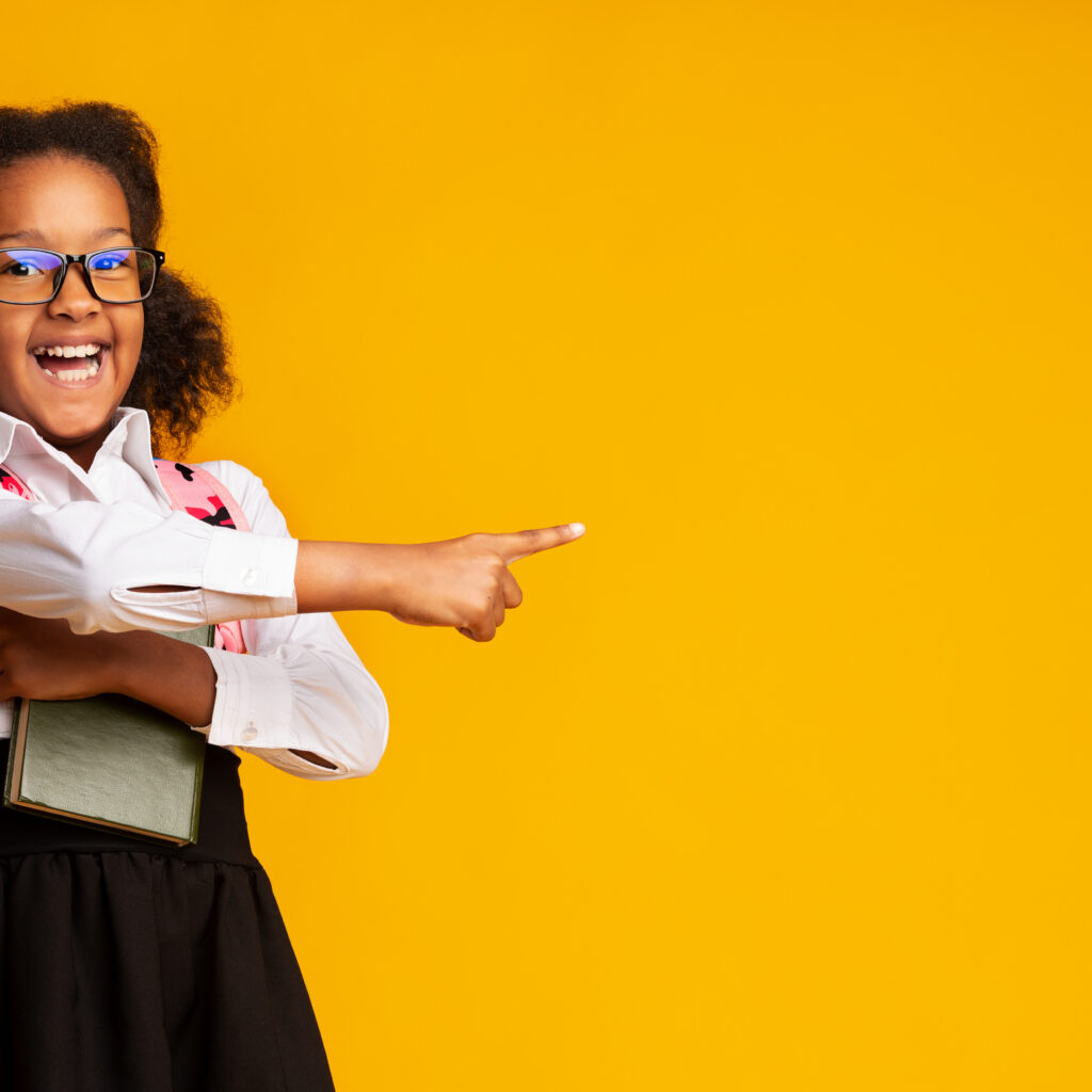 Look,There.,Excited,African,American,School,Girl,Pointing,Finger,At